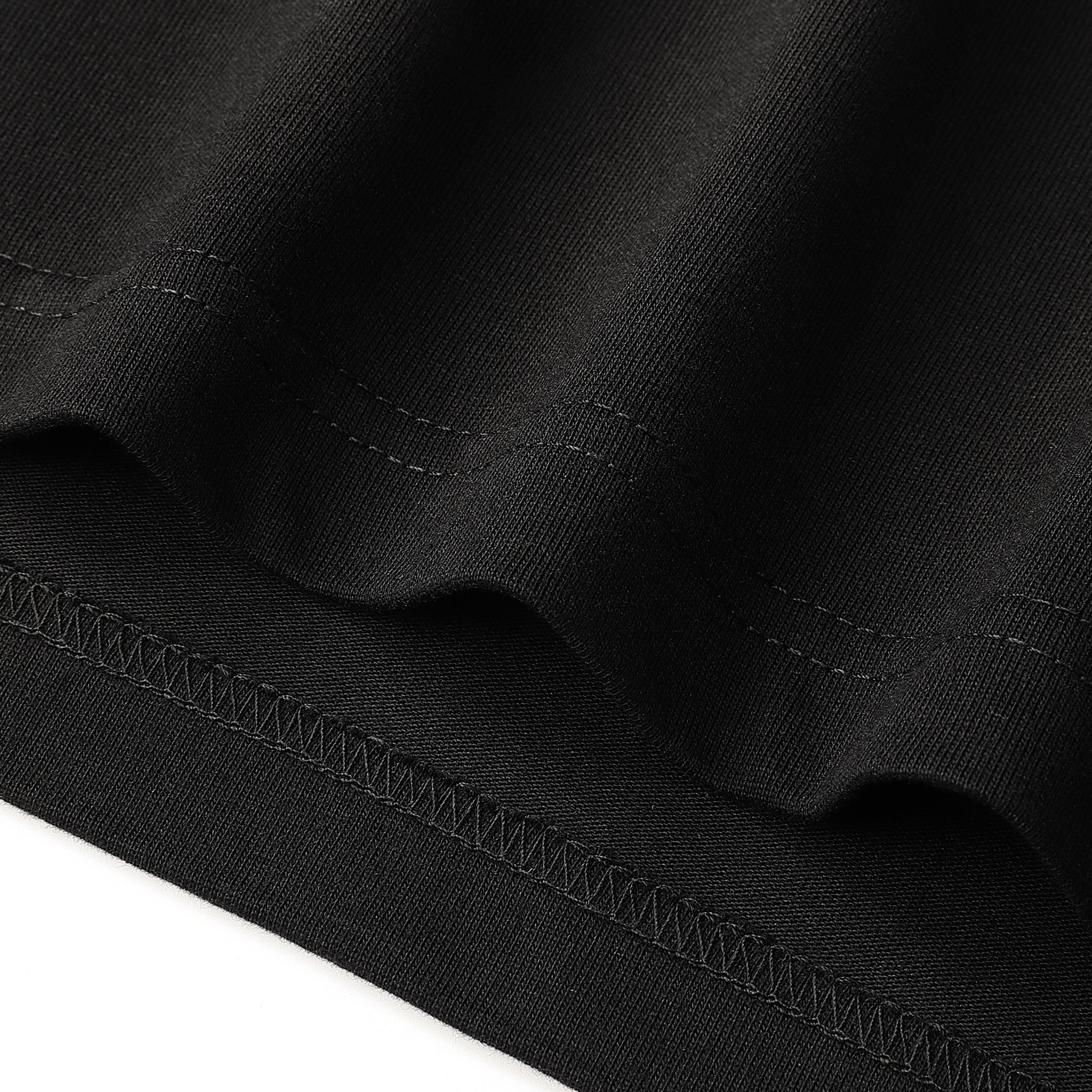 Iron Ethos Wordmark Tee, black short-sleeve T-shirt, close-up of stitching details.