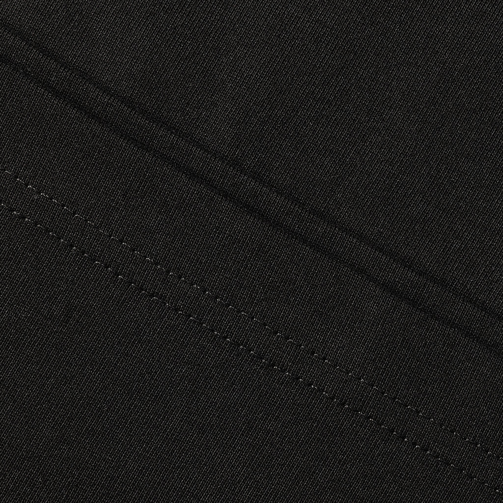 Iron Ethos Wordmark Tee, black short-sleeve T-shirt, close-up of stitching details.